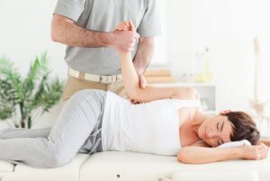 Chiropractor-Palatine-IL-woman-laying-on-table-with-chiropractor