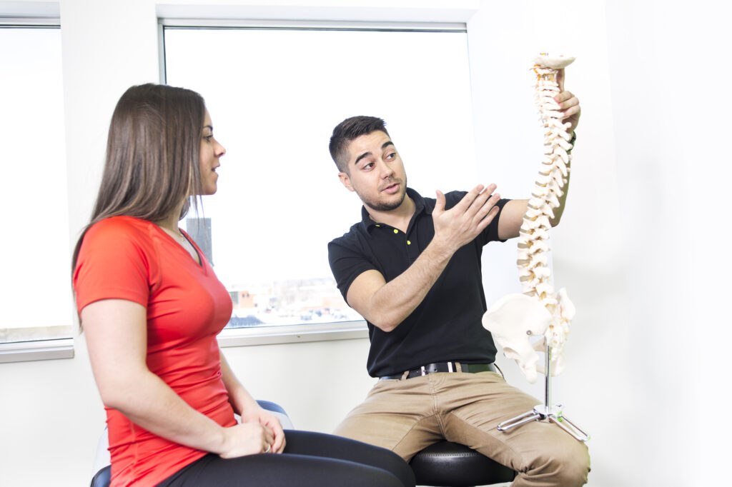 Chiropractic Billing Company - Female Patient Describing talk to Injury Osteopath